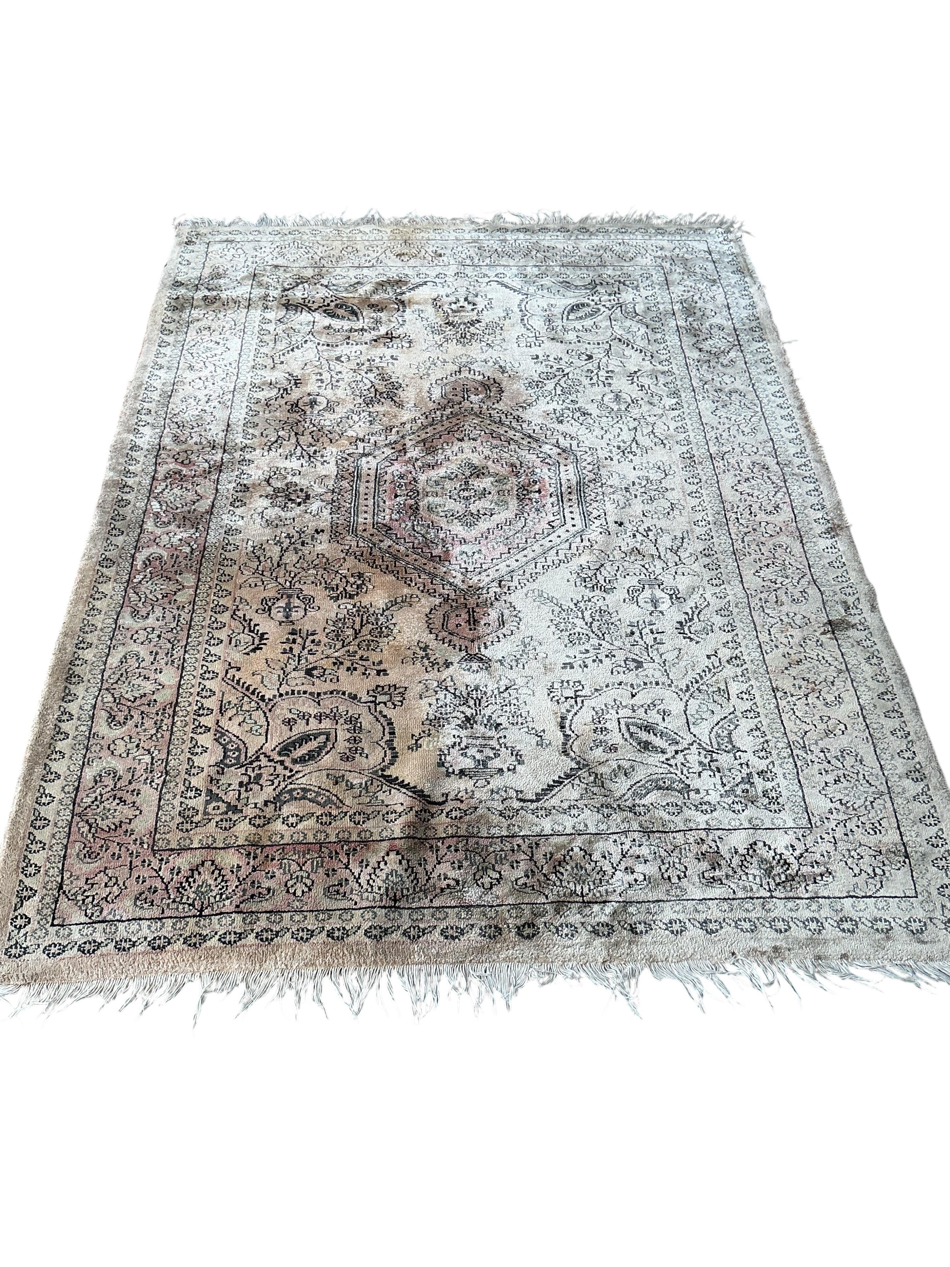 A North West Persian peach ground part silk rug and a Caucasian style rug, larger 175 x 126cm
